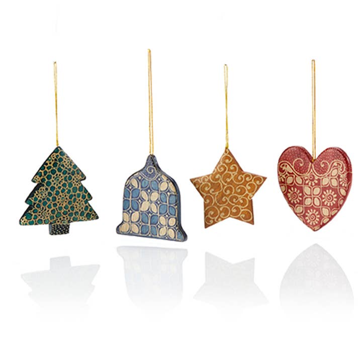 Batiked wood ornaments in tree, bell, star, and heart, just like your favorite cookies.